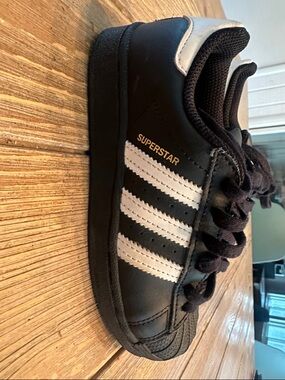 adidas Black and White Superstar Sneakers with Gold Accent